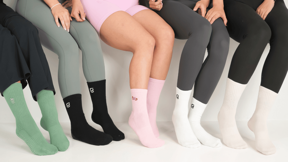 image of 5 pairs of gravi grip socks on 5 pairs of feet