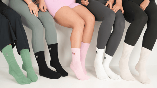 image of 5 pairs of gravi grip socks on 5 pairs of feet