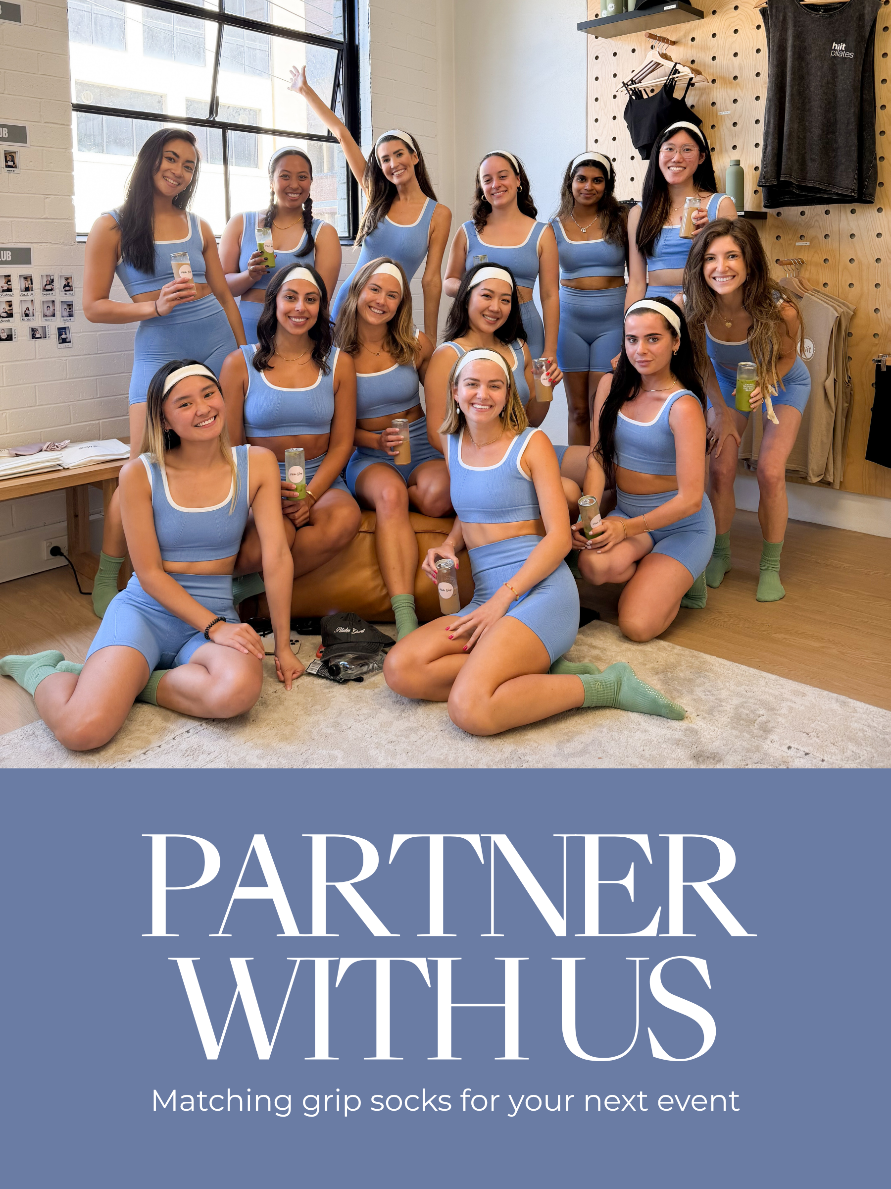 Group of women in matching blue outfits and Gravi grip socks posing together with text 'Partner With Us' on a blue background.