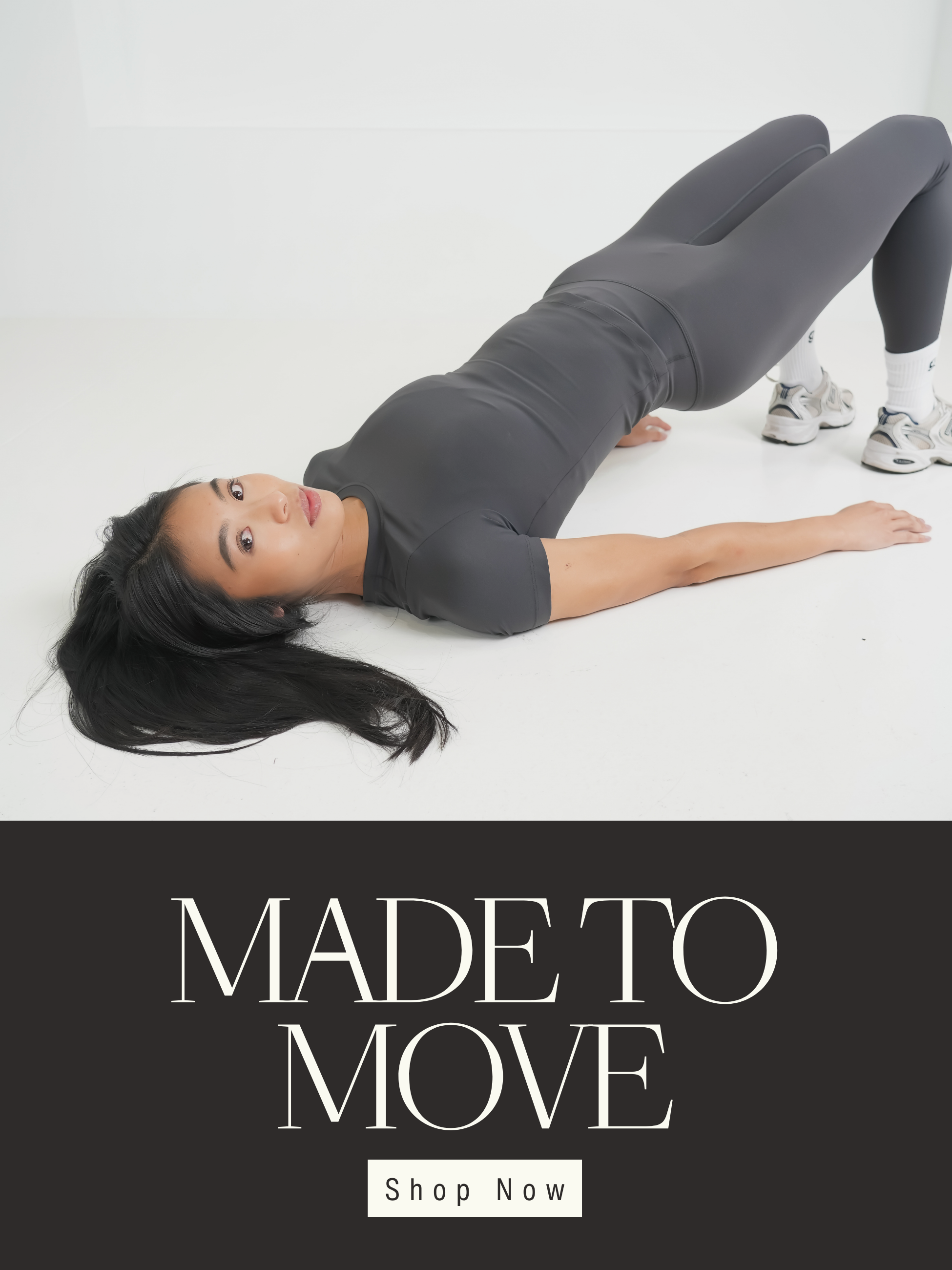 Person in gray athletic wear lying on a white floor with grip socks on with 'Made to Move' text and 'Shop Now' button.