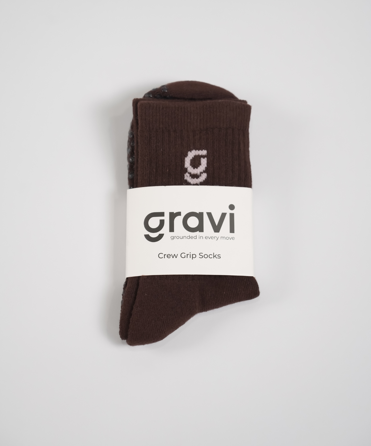 Brown crew grip socks with soft pink 'g' embroidered and gravi packaging