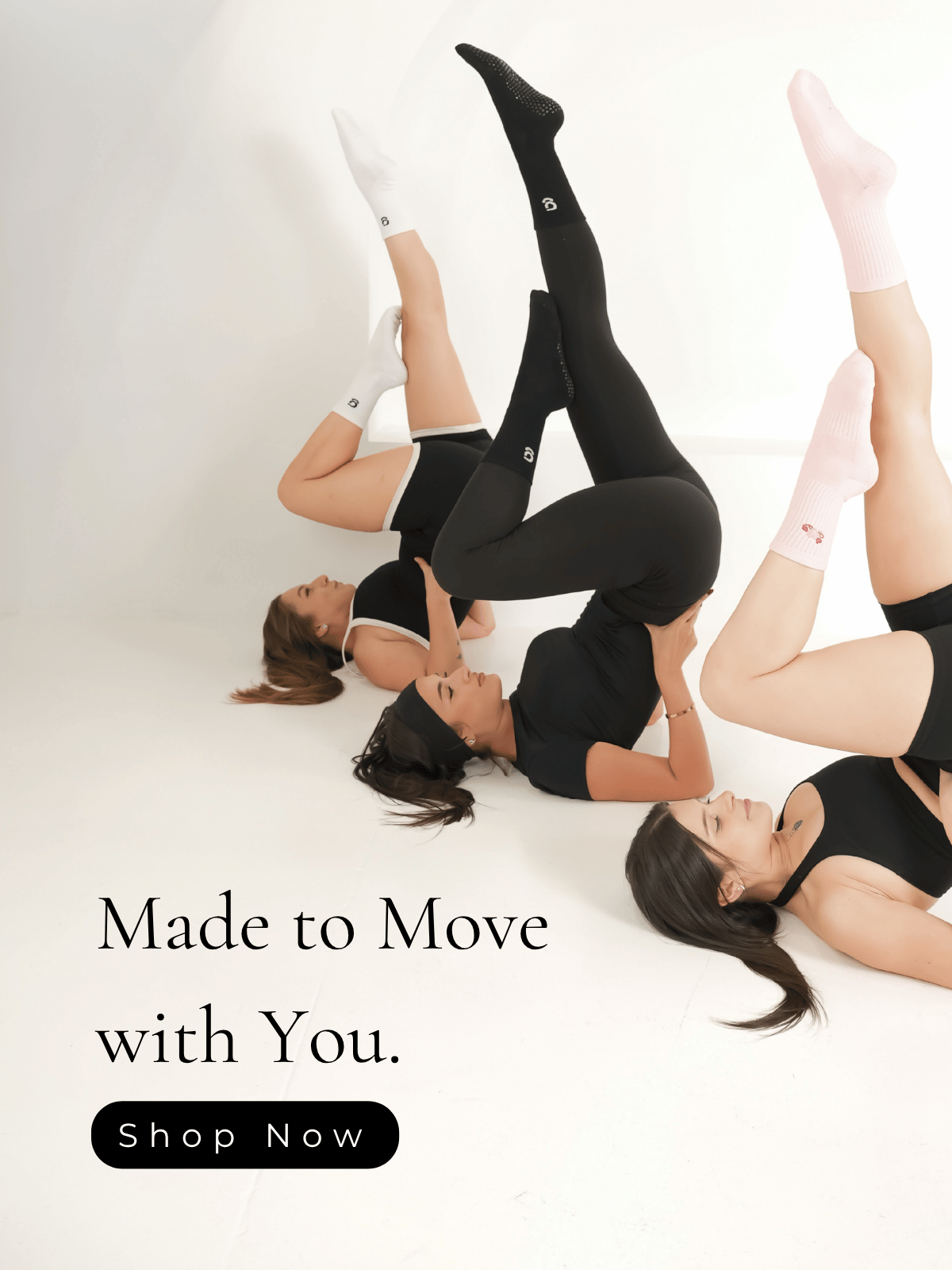 people wearing gravi grip socks with the text 'made to move with you' and a 'shop now' button