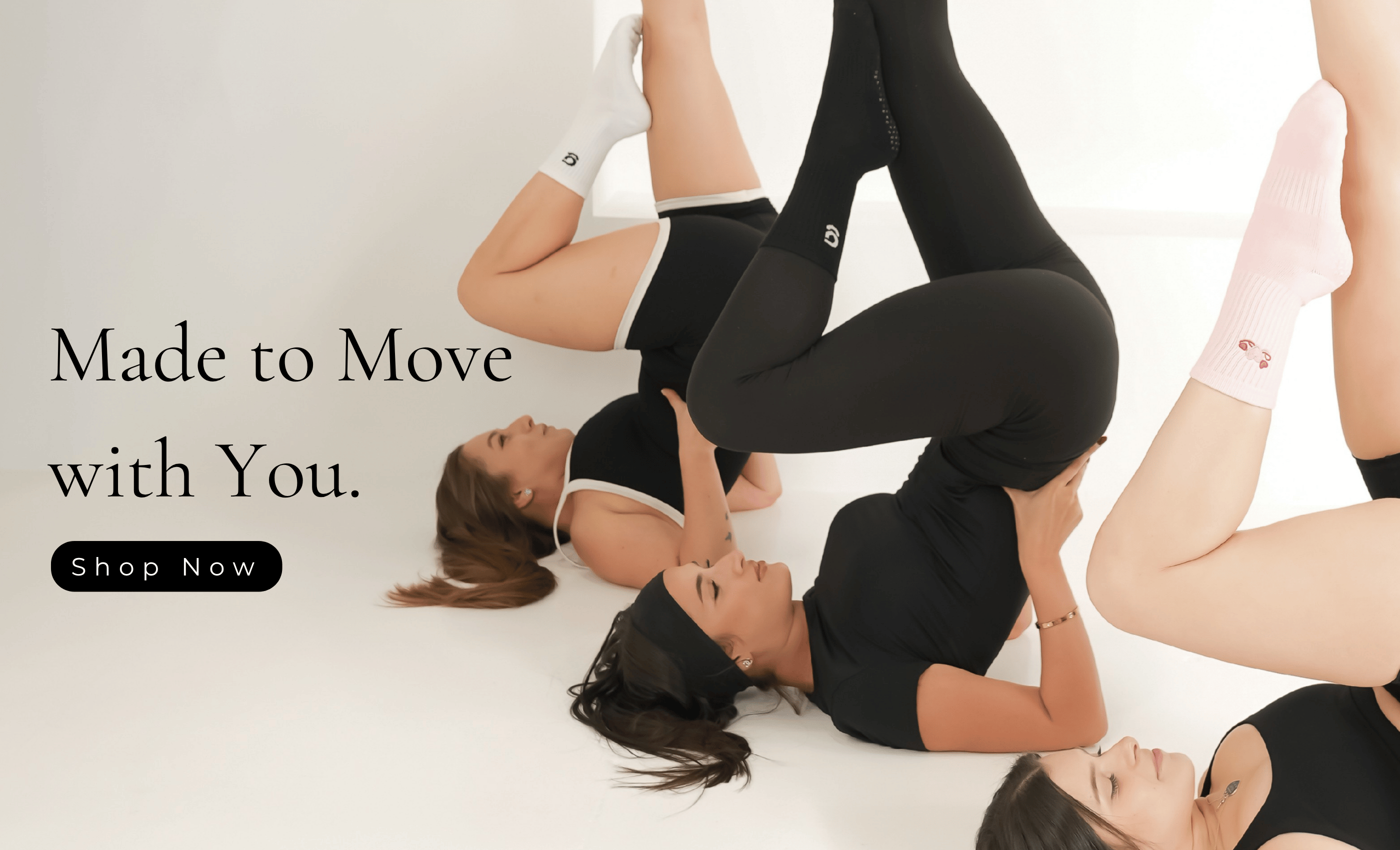people wearing gravi grip socks with the text 'made to move with you' and a 'shop now' button